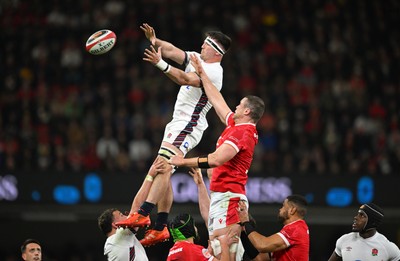 150325 - Wales v England - Guinness Six Nations - Tom Curry of England wins the line out ball ahead of Will Rowlands of Wales