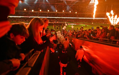 150325 - Wales v England - Guinness Six Nations - Players of England and Wales make their way out for the start