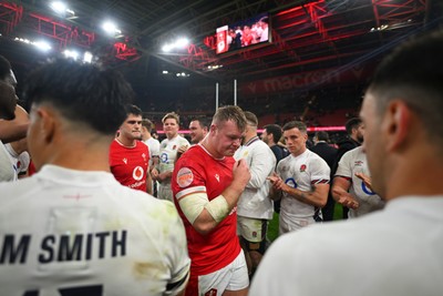 150325 - Wales v England - Guinness Six Nations - Players of Wales make their way off following the end