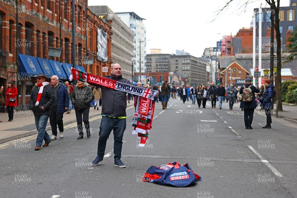 150325 - Wales v England - Guinness Six Nations - Scarf seller on Westgate Street before the match