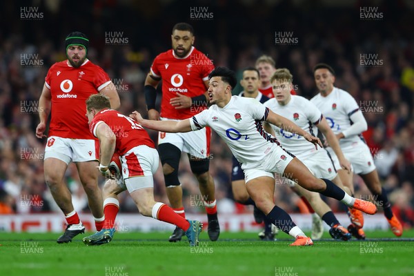 150325 - Wales v England - Guinness Six Nations - Blair Murray of Wales evades the tackle of Marcus Smith of England