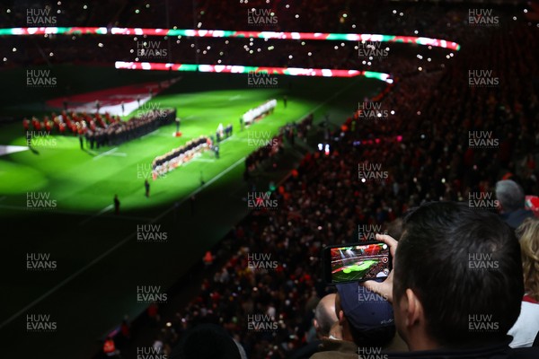 150325 - Wales v England - Guinness Six Nations - A fan records the national anthems prior to the game