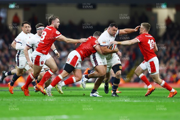 150325 - Wales v England - Guinness Six Nations - Ellis Genge of England is tackled by Elliot Dee and Gareth Anscombe of Wales 