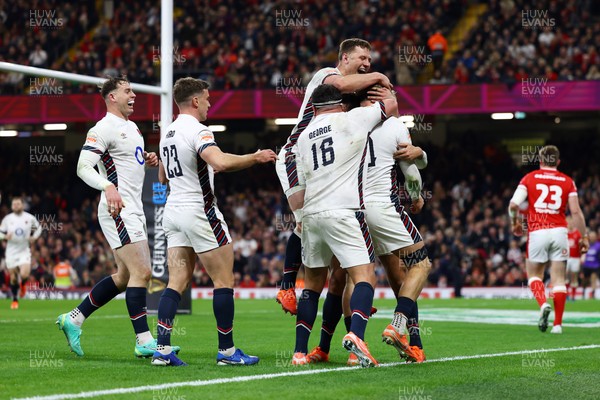 150325 - Wales v England - Guinness Six Nations - Henry Pollock of England celebrates with teammates after scoring his team's seventh try