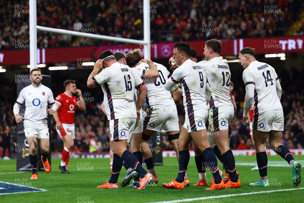 150325 - Wales v England - Guinness Six Nations - Henry Pollock of England celebrates with teammates after scoring his team's seventh try