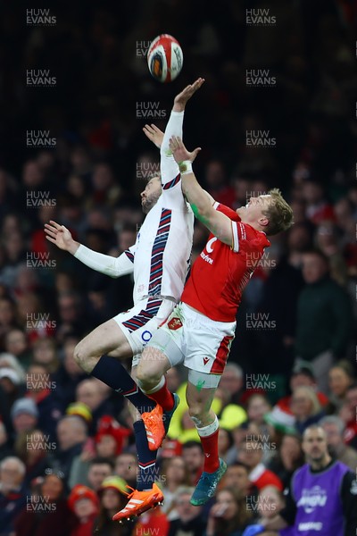 150325 - Wales v England - Guinness Six Nations - Elliot Daly of England jumps for the ball with Blair Murray of Wales