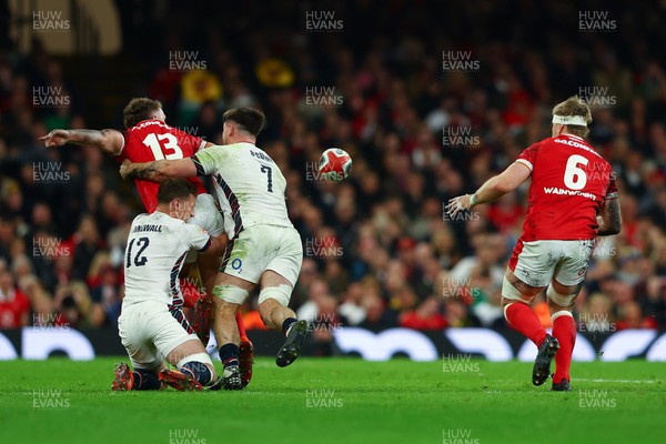 150325 - Wales v England - Guinness Six Nations - Max Llewellyn of Wales offloads to Aaron Wainwright of Wales as he is tackled by Fraser Dingwall and Ben Curry of England