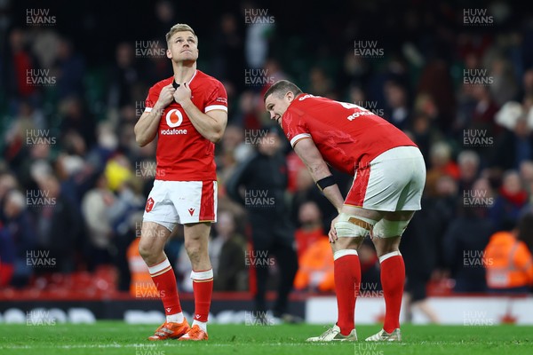 150325 - Wales v England - Guinness Six Nations - Gareth Anscombe and Will Rowlands of Wales look dejected following the team's defeat