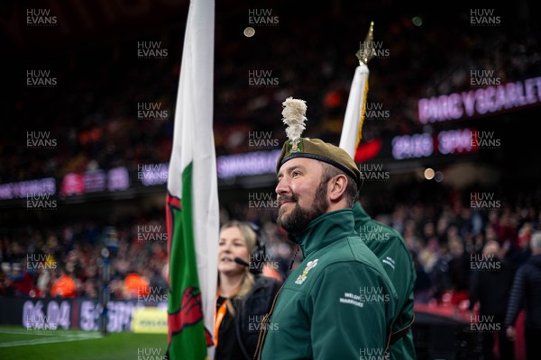 150325 - Wales v England - Guinness Six Nations - Army personnel prepare to walk on to the pitch during pre-march 