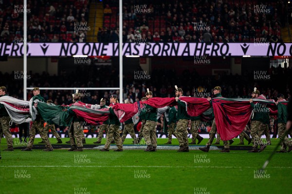 150325 - Wales v England - Guinness Six Nations - Soldiers prepare to unfurl the Welsh flag 