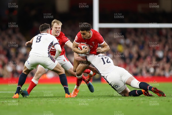 150325 - Wales v England - Guinness Six Nations Championship - Ben Thomas of Wales is tackled by Fraser Dingwall of England 