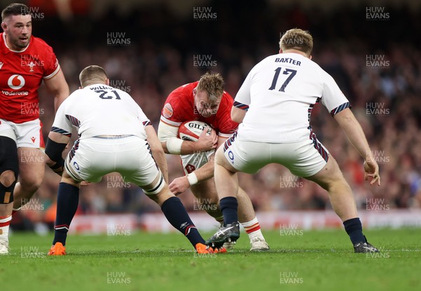 150325 - Wales v England - Guinness Six Nations Championship - Dewi Lake of Wales is tackled by Tom Willis and Fin Baxter of England 