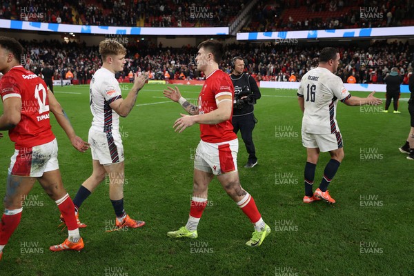 150325 - Wales v England - Guinness Six Nations Championship - Fin Smith of England and Joe Roberts of Wales at full time