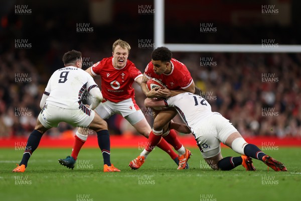 150325 - Wales v England - Guinness Six Nations Championship - Ben Thomas of Wales is tackled by Fraser Dingwall of England 