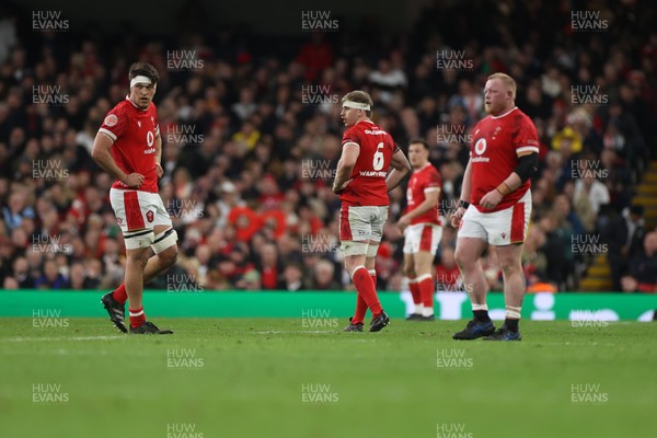 150325 - Wales v England - Guinness Six Nations Championship - Teddy Williams, Aaron Wainwright and Keiron Assiratti of Wales 