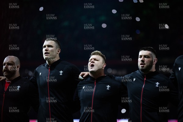 150325 - Wales v England - Guinness Six Nations Championship - Will Rowlands, Dewi Lake and Gareth Thomas of Wales sing the anthem