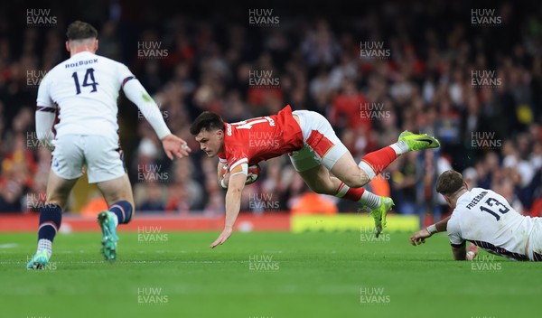 150325 Wales v England, Guinness Mens Six Nations - Joe Roberts of Wales is tackled by  Tommy Freeman of England