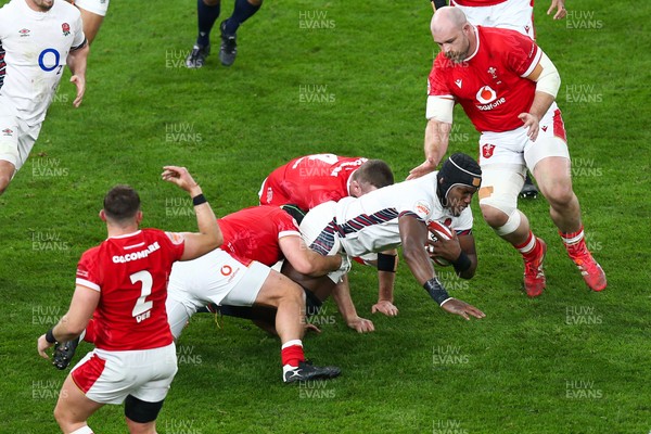 150325 - Wales v England - Guinness Six Nations - Maro Itoje of England is tackled