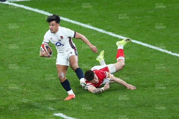 150325 - Wales v England - Guinness Six Nations - Marcus Smith of England escapes the tackle of Max Llewellyn of Wales