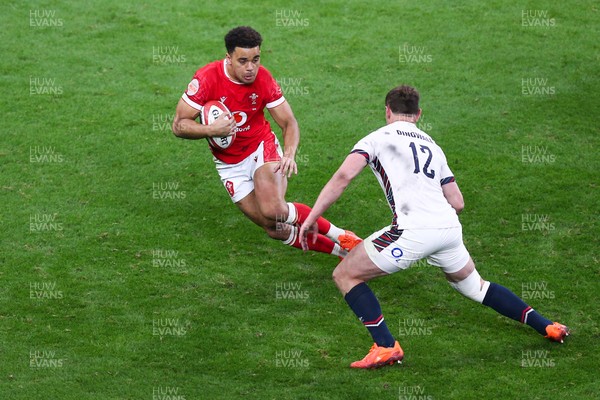 150325 - Wales v England - Guinness Six Nations - Ben Thomas of Wales takes on Fraser Dingwall of England