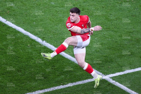 150325 - Wales v England - Guinness Six Nations - Joe Roberts of Wales kicks the ball