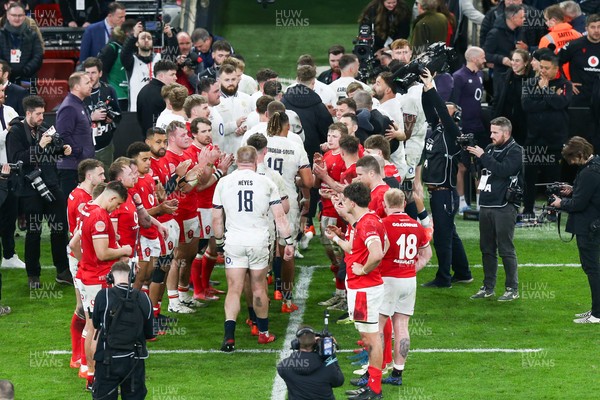 150325 - Wales v England - Guinness Six Nations - England are clapped off the pitch by Wales players at the end of the match