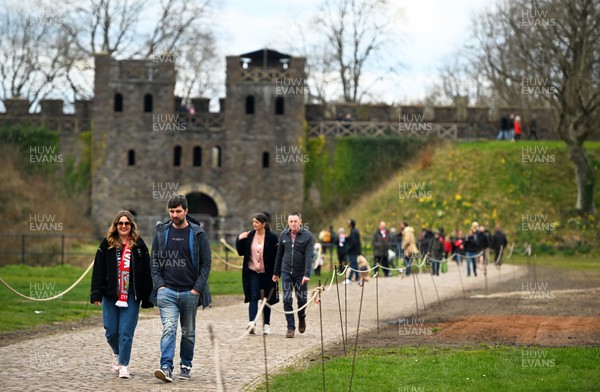 150325 - Wales v England - Guinness Six Nations - Fans make their way past Cardiff Castle ahead of kick off 