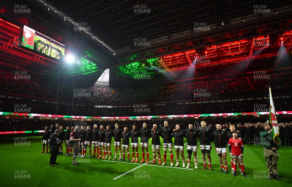 150325 - Wales v England - Guinness Six Nations - Players of Wales line up for the National Anthems 