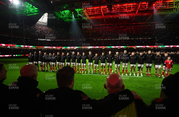 150325 - Wales v England - Guinness Six Nations - Players of Wales line up for the National Anthems 