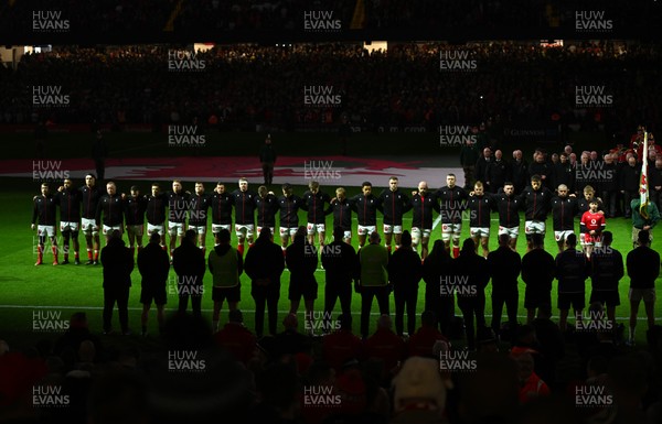 150325 - Wales v England - Guinness Six Nations - Players of Wales line up for the National Anthems 