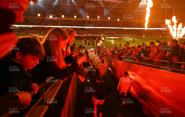 150325 - Wales v England - Guinness Six Nations - Players of England and Wales make their way out for the start