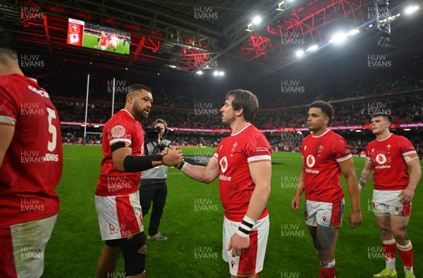 150325 - Wales v England - Guinness Six Nations - Players of Wales embrace following the end of the match 