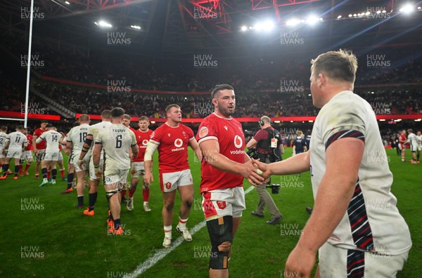 150325 - Wales v England - Guinness Six Nations - Players of England and Wales shake hands following the end of the match