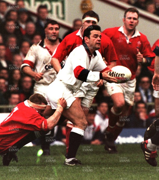 150397 - Wales v England - Five Nations - Will Carling of England is tackled by Kingsley Jones