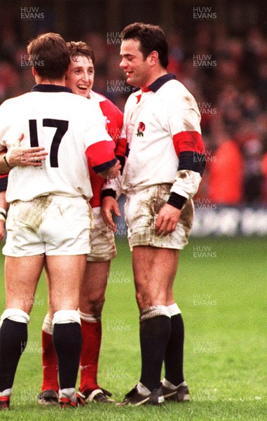 150397 - Wales v England - Five Nations - Jonathan Davies hugs Andrew and Will Carling