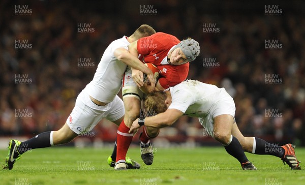 160313 - Wales v England - RBS Six Nations 2013 -Jonathan Davies of Wales is tackled by Owen Farrell and Tom Youngs of England