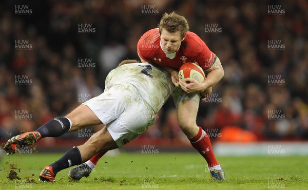 160313 - Wales v England - RBS Six Nations 2013 -Dan Biggar of Wales is tackled by Tom Youngs of England