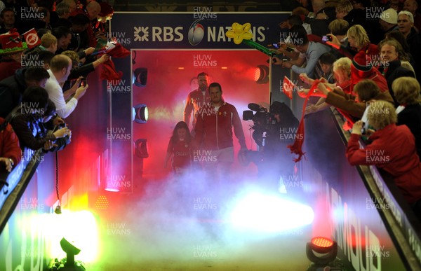 160313 - Wales v England - RBS Six Nations 2013 -Wales captain Gethin Jenkins leads out his team with mascot Grace Baston