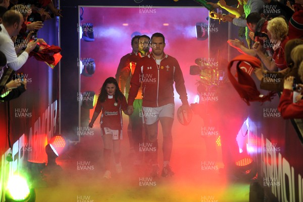 160313 - Wales v England - RBS Six Nations 2013 -Wales captain Gethin Jenkins leads out his team with mascot Grace Baston