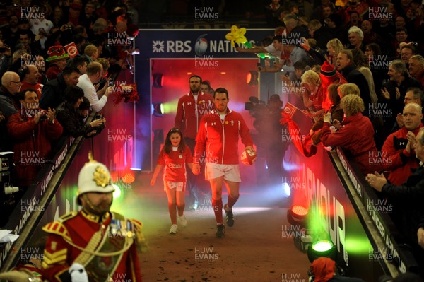 160313 - Wales v England - RBS Six Nations 2013 -Wales captain Gethin Jenkins leads out his team with mascot Grace Baston