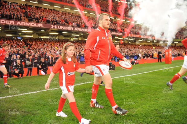 160313 - Wales v England - RBS Six Nations 2013 -Wales captain Gethin Jenkins leads out his team with mascot Grace Baston