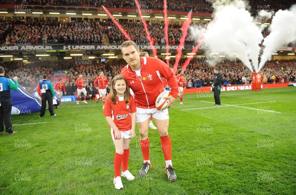 160313 - Wales v England - RBS Six Nations 2013 -Wales captain Gethin Jenkins leads out his team with mascot Grace Baston