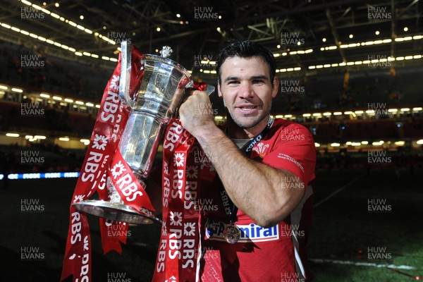 160313 - Wales v England - RBS Six Nations 2013 -Mike Phillips of Wales celebrates with the trophy at the end of the game 