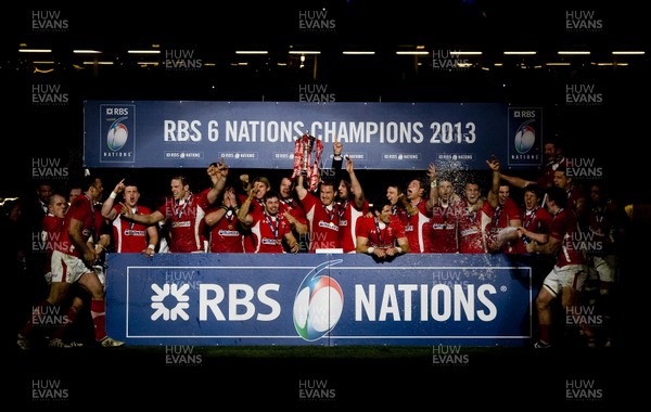 160313 - Wales v England - RBS Six Nations 2013 -Wales players celebrate in front of the champions board 