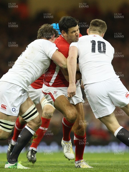 160313 - Wales v England - RBS 6 Nations - Wales' Mike Phillips  is stopped by England's Tom Wood and England's Owen Farrell