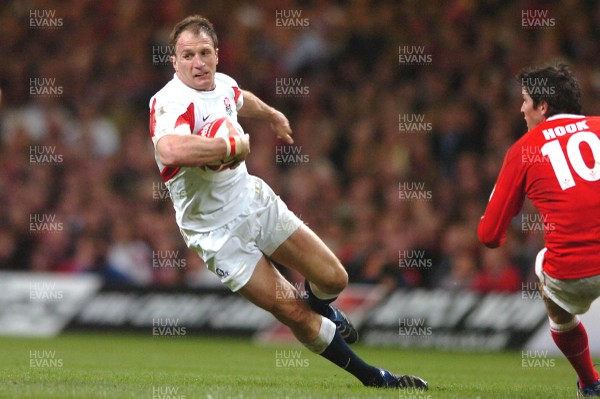 170307 - Wales v England - RBS Six Nations 2007 - England's Mike Catt slips as he tries to get past James Hook 