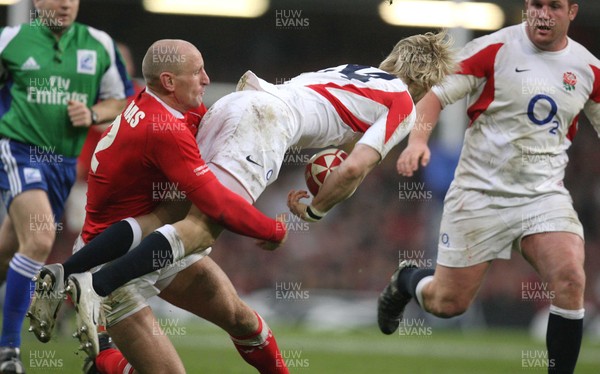 170307 - Wales v England - RBS 6 Nations -  Englands David Strettle is tackled by Gareth Thomas 