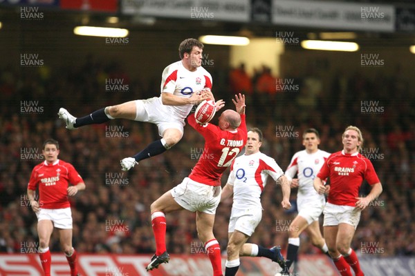 170307 - Wales v England - RBS 6 Nations -  England's Mark Cueto gets airborne above Gareth Thomas 