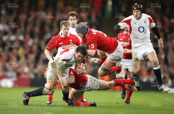 170307 - Wales v England - RBS 6 Nations -  England's Martin Corry is brought to ground by Alun_Wyn Jones and Alix Popham 