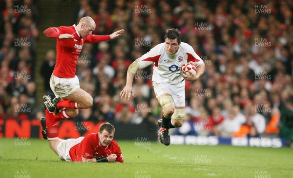 170307 - Wales v England - RBS 6 Nations -  England's Martin Corry looks for a way through as Matthew Rees is grounded and Gareth Thomas gets airborne 